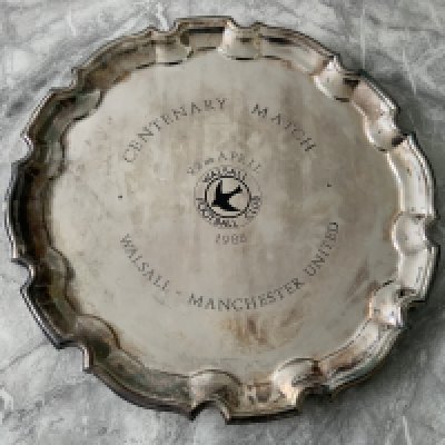 1988 Walsall v Manchester United Centenary Tray: Silver coloured large tray with the Words Centenary Match 22nd April 1988 around the Walsall swift logo. Walsall - Manchester United also embossed. Tarnished.