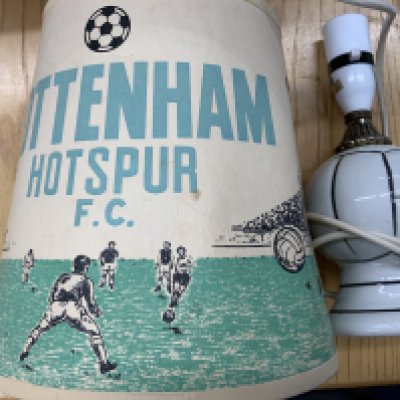Tottenham Football Memorabilia Boxes: Worth a look with an old Tottenham lampshade and lamp, silk scarves, Cup final caps, 1961 Cup Final cine film, fixture lists, away Spurs Legends friendly programmes, calendar, quantity of mugs often still in packaging and more. (3 boxes)