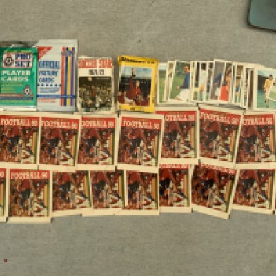 Football Cards + Stickers In Sealed Packs: 17 packs of Panini 90 a few Pro Sets plus a quantity of loose FKS World Cup 70 and Soccer Stars 71/72 + more.