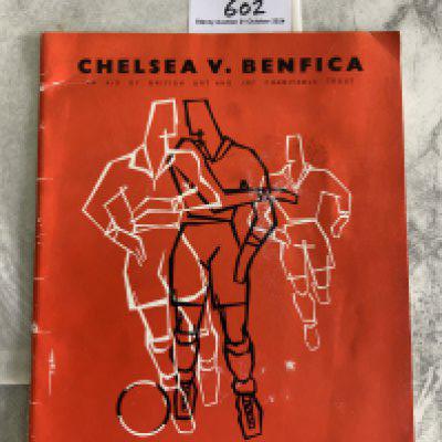 64/65 Chelsea v Benfica Charity Brochure: Red brochure with match details to front and date of the match at Stamford Bridge 7 10 1964. Beginning starts with details of the Charity etc then the large brochure has adverts of sponsors of the match. Good with slight scuff.