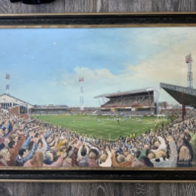 George Odlin Grimsby Town Ground Original Painting: Framed oil painting of Blundell Park in 1991 with Grimsby scoring v Exeter City and the packed ground celebrating. Signed by Grimsby player John Cockerill. Measures 90 x 60 cm and is not for posting.