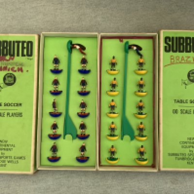 Subbuteo Football Memorabilia: Complete teams in boxes to include Barcelona Brazil Manchester City Manchester United Coventry Tottenham QPR Wolves and Celtic. Untested floodlights, pitch, scoreboard and a few loose players.