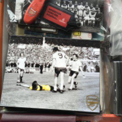 Miscellaneous Football Memorabilia Box: Includes coin sets, reserve sheets, Typhoo cards, wall charts, World Soccer Magazines, FA Cup brochures and much more. There is an original large framed 1959 England team group for match v Scotland removed from training ground in poor frame. Not for posting.