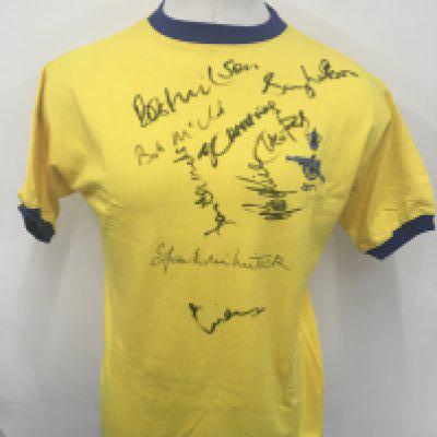 Arsenal 1971 FA Cup Final Signed Football Shirt: Yellow replica shirt the same as worn by the famous double team in their win v Liverpool. Signed to front by 9 players including Wilson George McNab and McLintock. Personally obtained by our vendor who used to arrange dinners in their honour.
