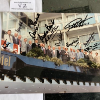 England 1966 World Cup Signed Reunion Football Photo: Rare 10 x 8 photo of the squad on a balcony probably taken in the late 70s with Moore holding trophy. Signed by 10 of the squad including Hunt Wilson Eastham Callaghan Peters Cohen and Hurst.