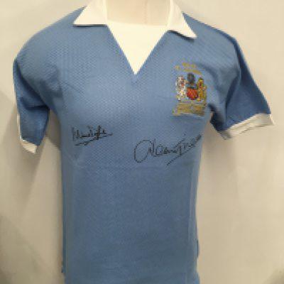 Manchester City 1976 League Cup Final Signed Football Shirt: Blue airtek style shirt with white collar. MCFC above crest and Wembley 1976 below. Signed to front by winning goal scorer Tueart and captain Doyle.