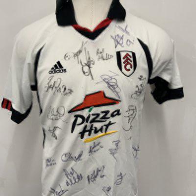 Fulham 2001 - 2002 Signed Football Shirt: Home short sleeve shirt sponsored by Pizza Hut with labels still attached. Fully signed with list of players signed including Saha Boa Morte Van Der Sar and manager Tigana. Coa included.