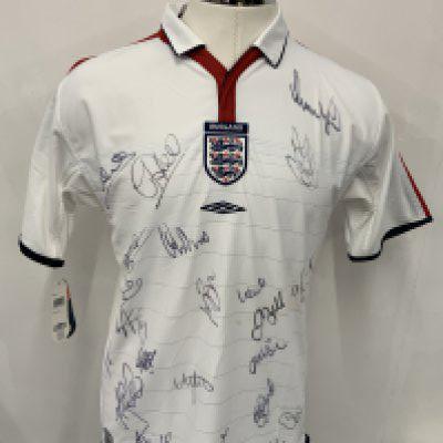 England Euro 2004 Multi Signed Football Shirt: White home shirt in size large brand new with tags. Given to major sponsor who attended the tournament. Signed clearly to front by 21 including Lampard Owen and Beckham. Couple of marks.