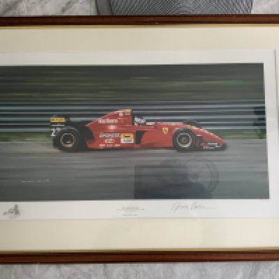 Jean Alesi 1995 Grand Prix Motor Racing Framed Print: Limited edition large print number 286/500 featuring Alesi in his Ferrari winning the Canadian Grand Prix on his 31st birthday. Print is framed and named Bon Anniversaire. Signed by the artist Gerald Coulson.