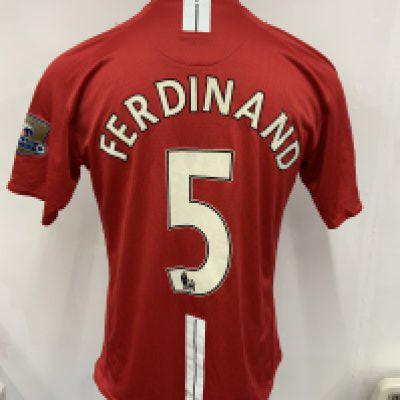 Rio Ferdinand Manchester United Match Worn Football Shirt: Red short sleeve home shirt worn in 2007 - 2008 v Arsenal. Gold sleeve patches state 06/07 Champions. Number 5 Ferdinand to rear. Swapped with Kolo Toure.