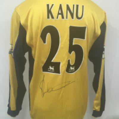 Arsenal Kanu 1999 - 2001 Match Worn Away Shirt: Yellow with blue long sleeves Nike SEGA sponsored XL shirt. Rear has Kanu number 25 and is clearly signed by him. Few mud marks mainly to sleeve. Obtained by team mate Paul Merson.