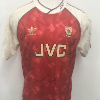 Arsenal 1990 - 1991 Champions Signed Football Shirt: Original red home shirt sponsored by JVC. Signed to front by 13 players including Dixon Marwood Winterburn Parlour Dikov Smith Adams Lukic and the late great Kevin Campbell. Former property of Paul Merson. Arsenal were Champions and this was signed early on as Marwood and Lukic left pre season.