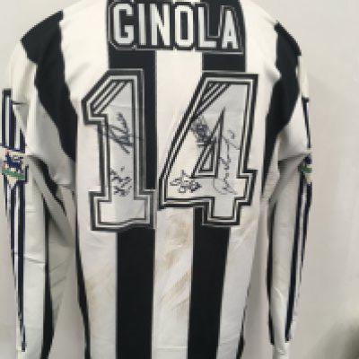 Newcastle 1996 - 1997 Ginola Match Worn Football Shirt: Long sleeve black and white unwashed Newcastle Brown Ale Adidas shirt with number 14 Ginola to rear. Believed to be worn on 3 5 1997 and swapped with Paul Merson.