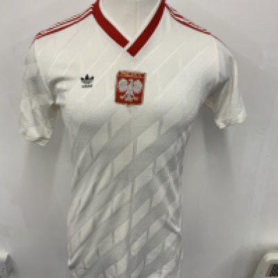 Poland 1989 Under 21 Match Worn Football Shirt: White with red trim short sleeve Adidas shirt with number 4 to rear. Polska badge to chest. Believed to be worn v England on 2 6 1989 and swapped with Paul Merson.