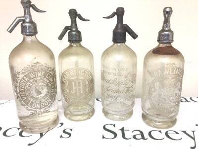 Four Early examples of  Soda Syphine each with acid etched  labelling and branding including Harrington Southend. (4)