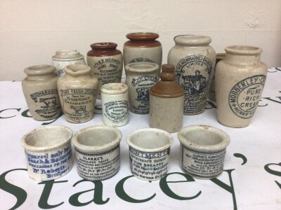 A Collection of intresting early 19th century white glazed stoneware Ointment pots for sore Breasts bad legs skin eruptions etc and a quantity of Dairy Cream stoneware jars with trade labels. NO RESERVE.