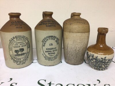 Three large stoneware flagons Southend Mineral Water 1936 Mackintosh Kingsway Mineral water Thomas Johnson Edinburgh and a smaller jug with floral pattern H Kenneth Glasgow (4) NO RESERVE.