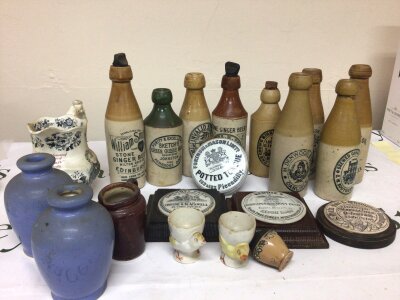 A collection of Victorian Ginger Beer and mineral stoneware bottles four Victorian pot lids including Fortnum & Masons Potted Tongue a Royal Doulton George IV commemorative scotch Whisky jug and other ceramics. NO RESERVE.