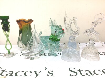 A Murano glass ornament in the form of a dog glass figures dancing ladies a Murano glass vase and a sailing boat and other glass ornaments.