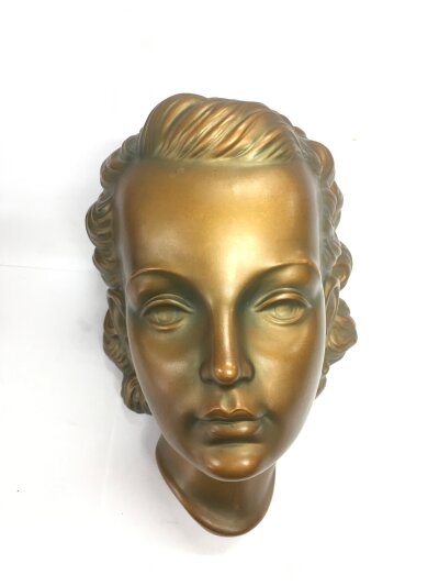 A mid 20th Century terracotta wall mask of a young lady, approx height 23cm.