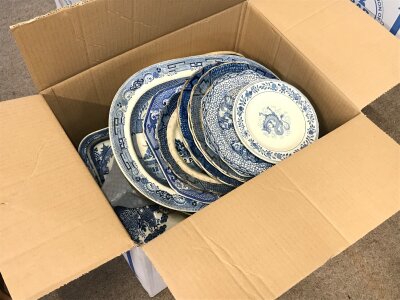 A box containing Blue and white plates including Willow Wedgwood, Delph wood & sons, Booths real old willow etc