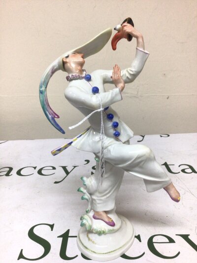 A 1930s Meissen figure The Masken Tanzer (mask dancer) designed 1933 by Scheurich. Under glazed marks to the base Germany.  Hight 26cm (minor repair to hat tail see image  other wise no condition issues)