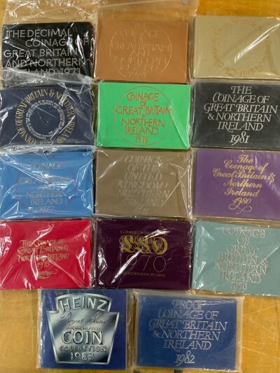 A consecutive run of Royal mint uncirculated proof British coin sets 1970-2007, plus a duplicate 1994, 1983 Heinz edition.