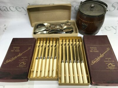 A collection of silver plated cutlery and a biscuit barrel.