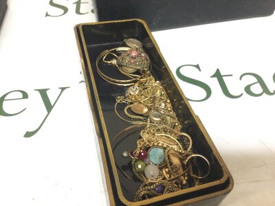A lacquer box containing costume Jewellery
