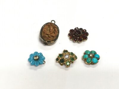 Five small pendants comprising four stone set examples.