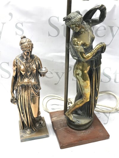 A bronze classical figure of Hebe the daughter of Zeus (30cm tall) and a lamp, Callipygian Venus a classical statue representing Venus adjusting her drapery. (62cm tall) (2)