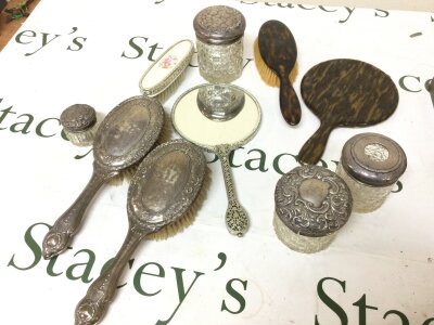 Silver topped dressing table jars and silver backed brushes