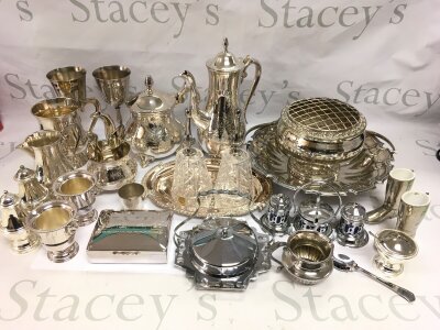 A box of silver plated items comprising cruet set, rose bowl, muffin dish etc.
