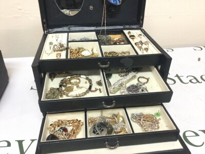 A jewellery box containing costume jewellery