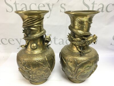 A pair of Chinese brass vases decorated with dragons in relief, approx height 25cm.