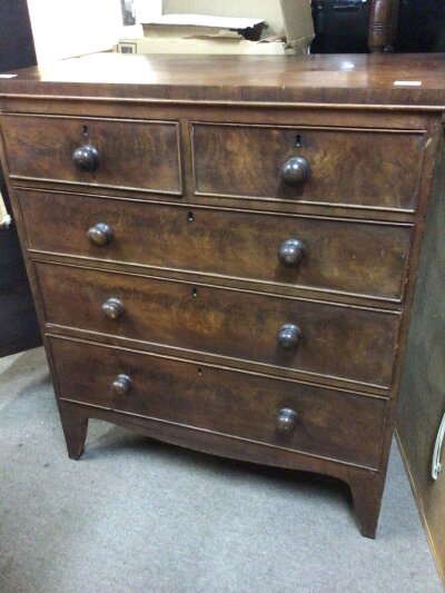 A Victorian Chest of drawers the rectangle top above two short and two long drawers on bracket feet.