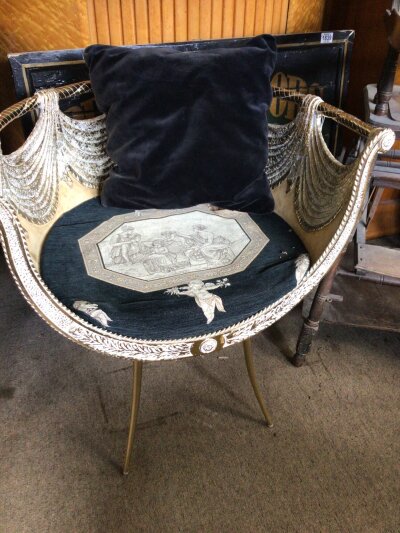 A Versace Style gilt metal chair the seat with a Roman inspired tapestry.