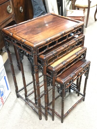 A nest of four Chinese hardwood tables.