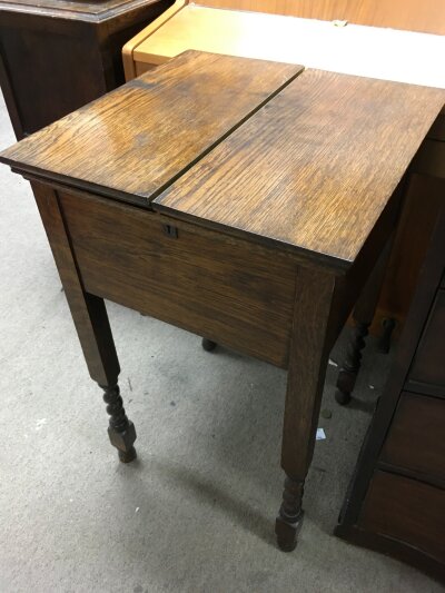 An oak work box with a concertina top, approx height 72cm.