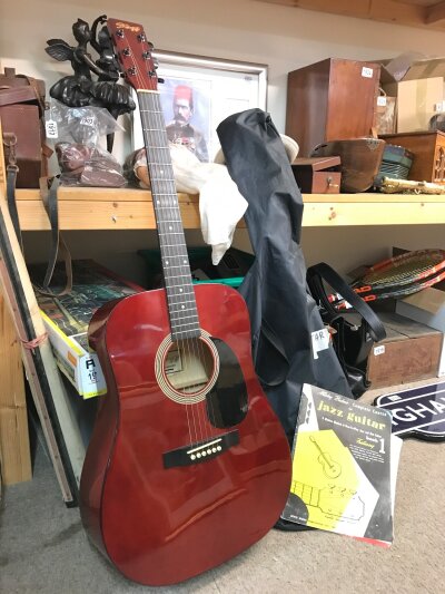 An acoustic Stagg guitar in good condition, full size 103cm and guitar jazz book- NO RESERVE