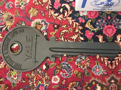 A large novelty metal Yale key. 68cm long