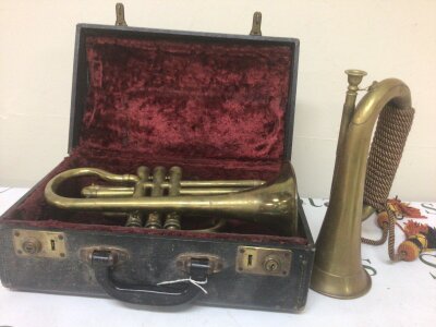 A Cased brass trumpet no obvious makers marks and a Military style bugle (2)