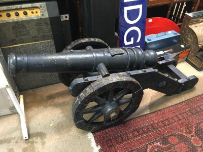 A large model of an antique cannon, approx length 145cm.