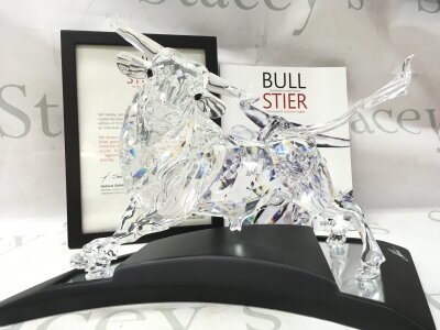A cased Swarovski Crystal 2004 bull figure. Limited edition number 2587 of 10000. Designed by Adi Stocker. No damage or restoration