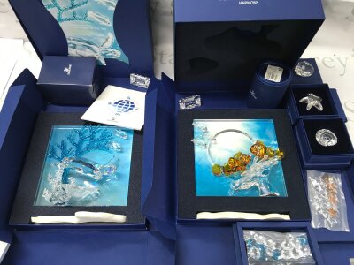 Swarovski crystal glass two boxed wonders of the sea figure groups Harmony and Eternity , also including some small boxed sea life figures and starfish, shells