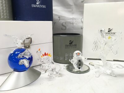 Swarovski crystal glass figure including Crystal Planet 2000 (Millennium Edition), snowman, dinosaur, bear with fish and eagle