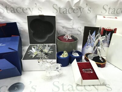 Swarovski boxed crystal glass figures including a stag, Masquerade Pierrot figure with stand and plaque , flowers, 2004 heart etc