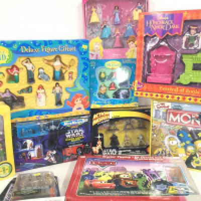 A Collection of Boxed toys including Micro Machines. Cars. A Simpsons Monopoly (Sealed) and Others.