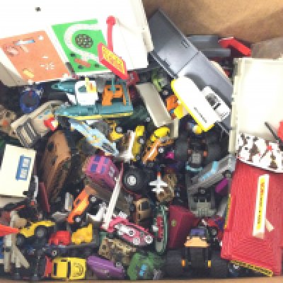 A Box containing a Collection Of Loose Micro Machines.
