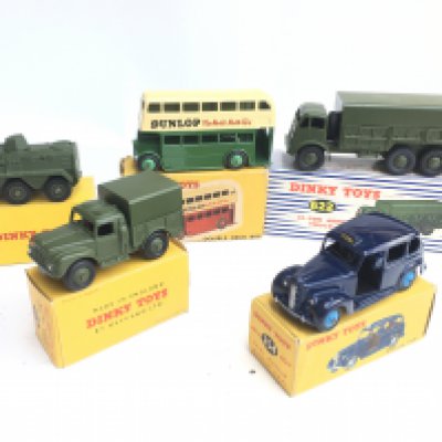 A Collection of Boxed Dinky Toys including a Austin Taxi. A Army 1 Ton Truck. A Armoured Personnel Carrier. Etc.